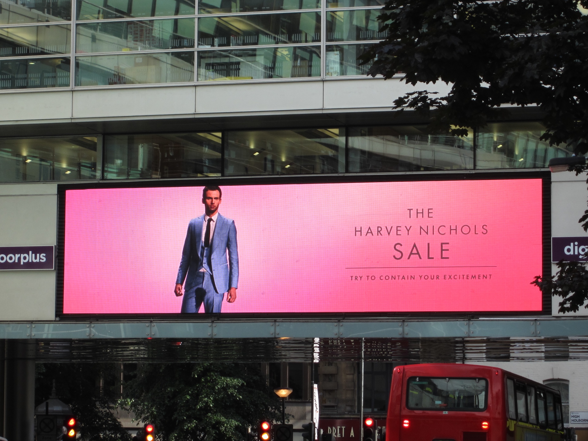Harvey Nichols “Try to Contain Your Excitement” advertising campaign — billboard pink suit, created by Toby Brewer